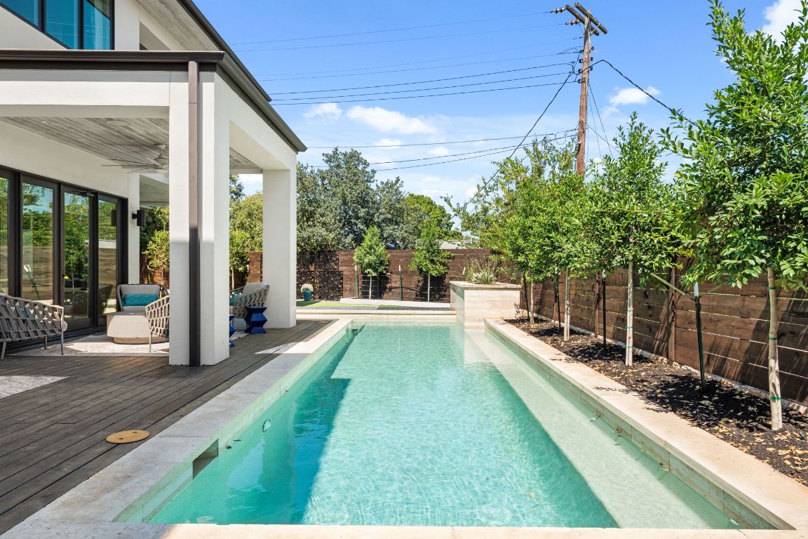 4908 Beverly Skyline Austin, TX 78731 - Photo 34 of 40 View of swimming pool featuring a fenced backyard and ceiling fan