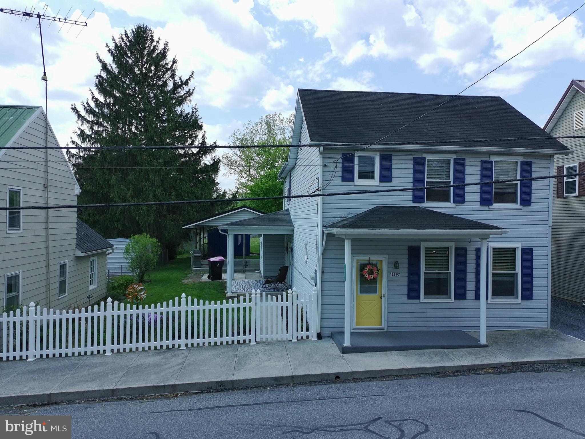12997 Main Street Fort Loudon, PA 17224 - Photo 1 of 48 a front view of a house with iron fence