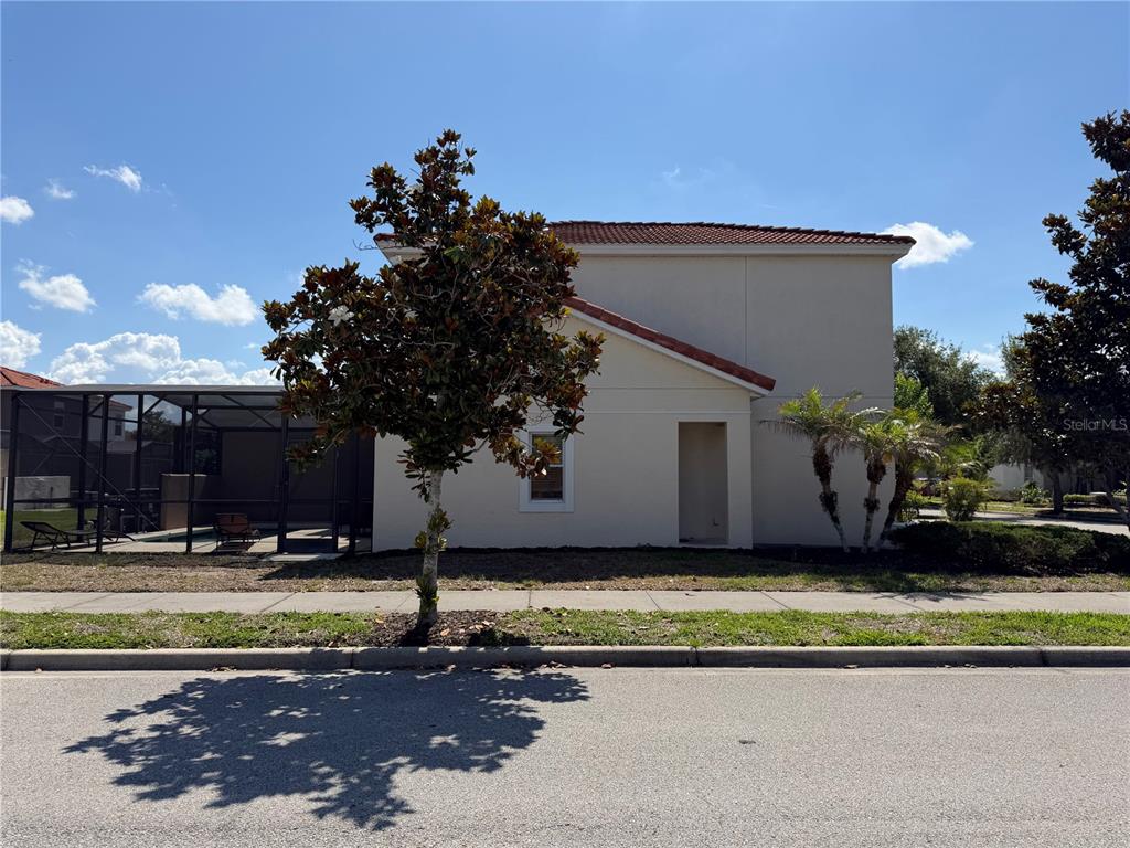 4573 Ada Lane Kissimmee, FL 34746 - Photo 3 of 37 a view of a swimming pool with an outdoor space