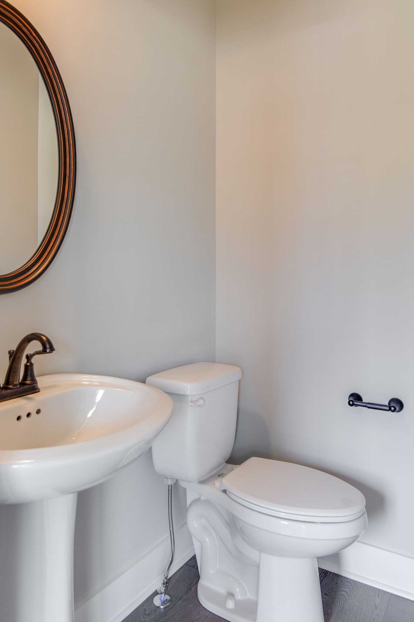 1026 Sycamore Ridge East, Unit 44 Burns, TN 37029 - Photo 18 of 28 a bathroom with a sink and a mirror