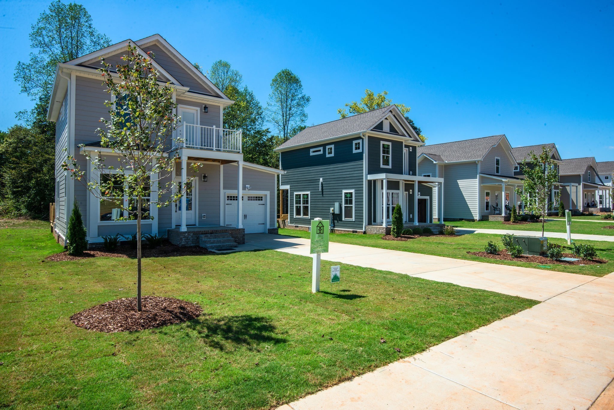 1026 Sycamore Ridge East, Unit 44 Burns, TN 37029 - Photo 5 of 28 a front view of a house with a yard