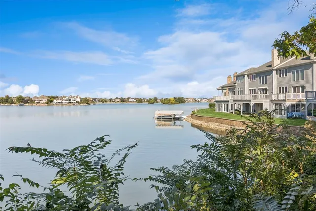 a view of a lake with houses in the background
