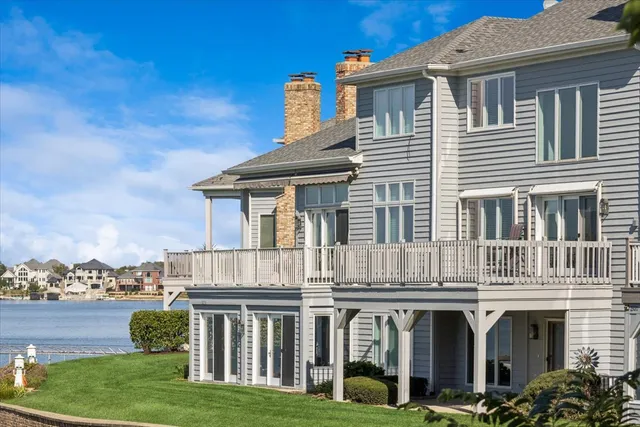 a front view of residential houses with yard