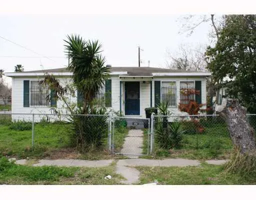 a view of house with a backyard and porch
