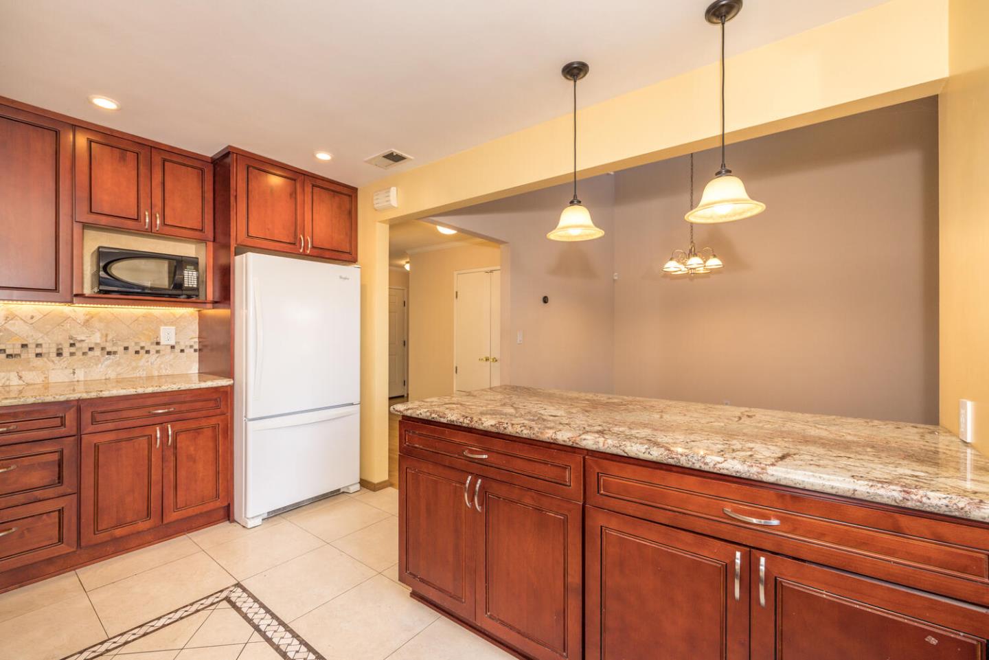 1170 Rickover Lane Foster City, CA 94404 - Photo 16 of 45 a kitchen with granite countertop cabinets and stainless steel appliances