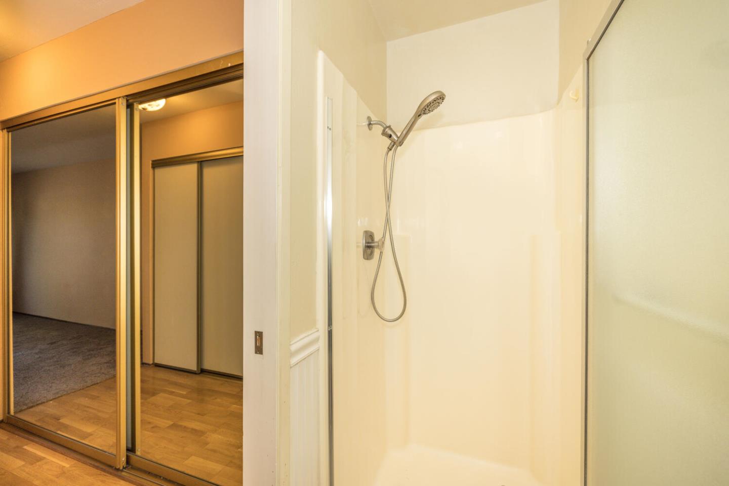 1170 Rickover Lane Foster City, CA 94404 - Photo 24 of 45 a bathroom with a glass shower door