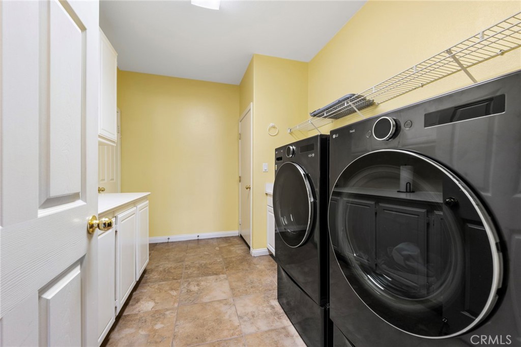 36005 Redgrave Way Murrieta, CA 92562 - Photo 13 of 42 a utility room with dryer and washer