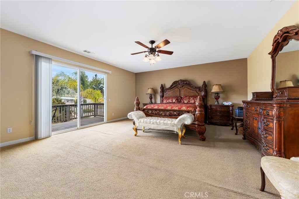 36005 Redgrave Way Murrieta, CA 92562 - Photo 24 of 42 a living room with furniture and a chandelier