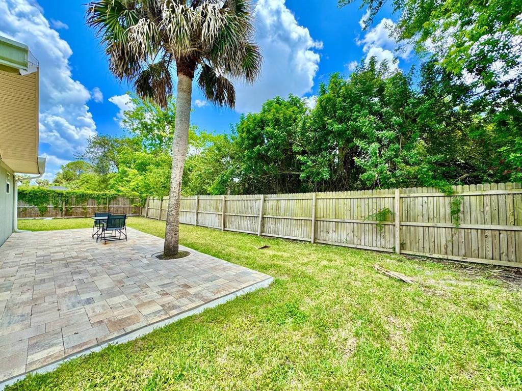 4282 Rudder Way New Port Richey, FL 34652 - Photo 33 of 34 a view of a backyard with grass