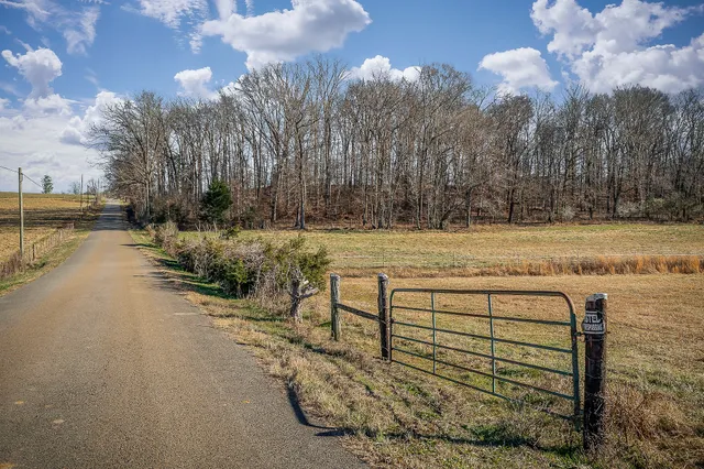 a backyard of a house with wooden fence