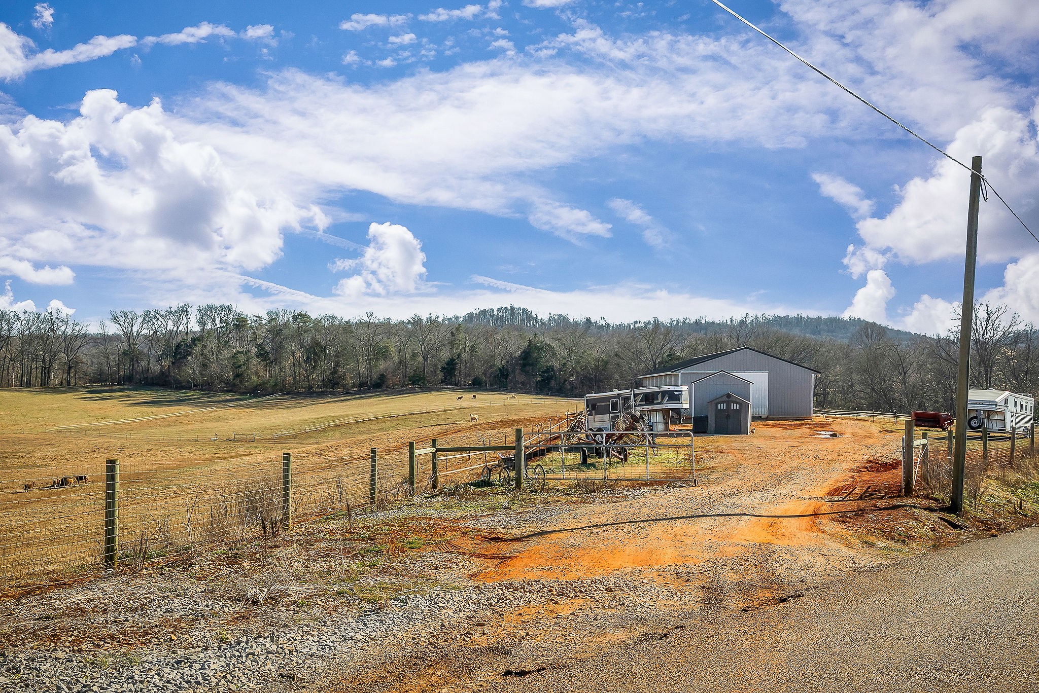 620 Roberts Cemetery Road Walling, TN 38587 - Photo 16 of 31 a view of a lake with a yard and wooden fence