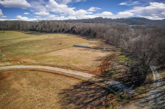 a view of a lake with houses in the back
