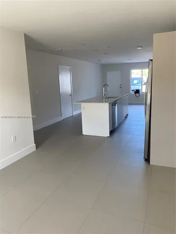 a view of kitchen and windows