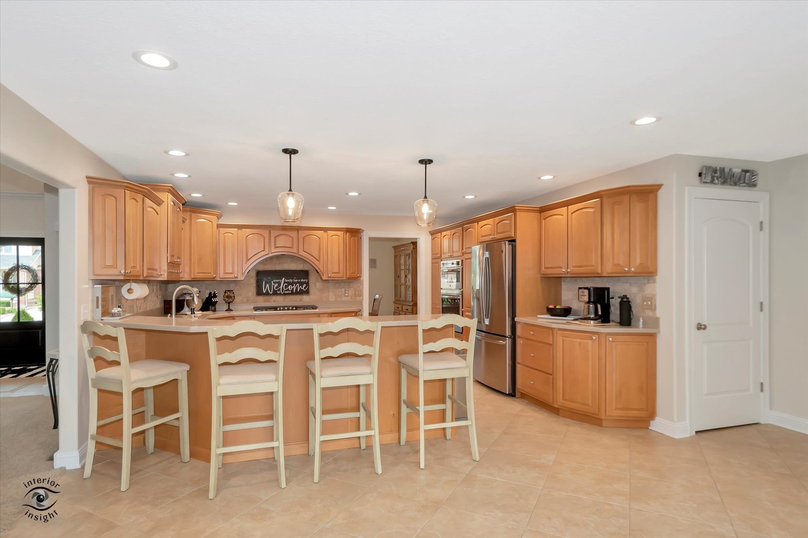 Undisclosed Address Bourbonnais, IL 60914 - Photo 13 of 39 a kitchen with stainless steel appliances kitchen island granite countertop a table and chairs