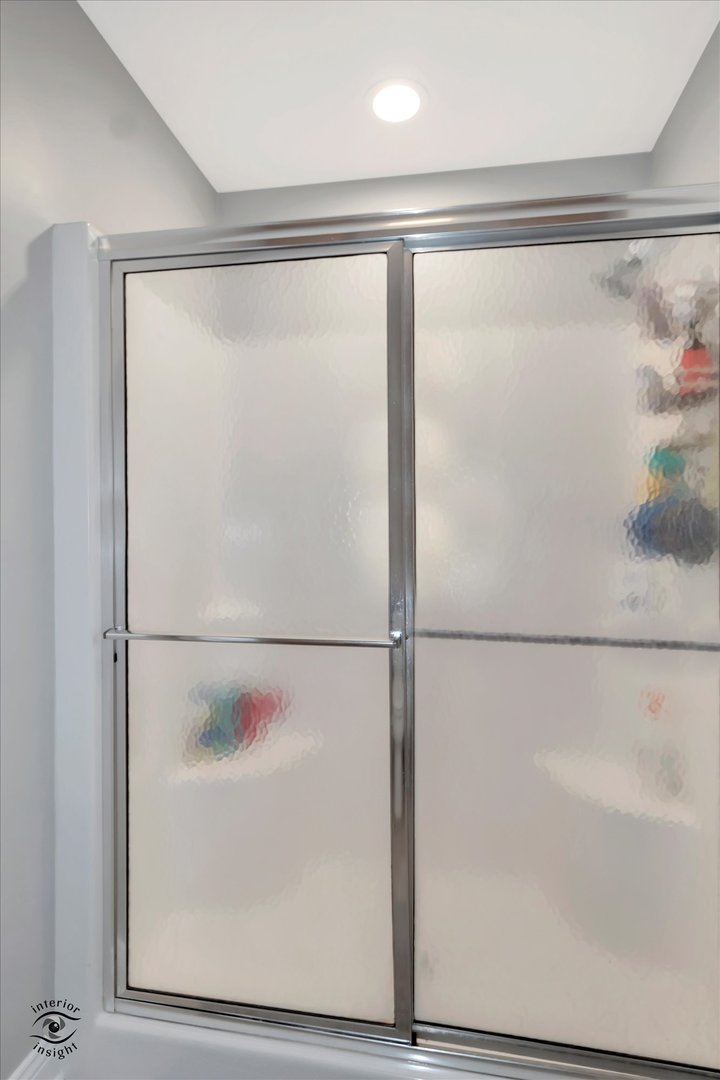 Undisclosed Address Bourbonnais, IL 60914 - Photo 19 of 39 a bathroom with a glass shower door