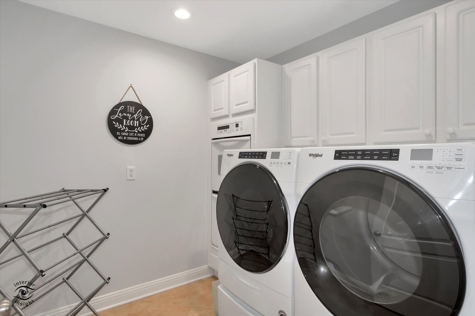 Undisclosed Address Bourbonnais, IL 60914 - Photo 24 of 39 a view of washer and dryer with kitchen in the background