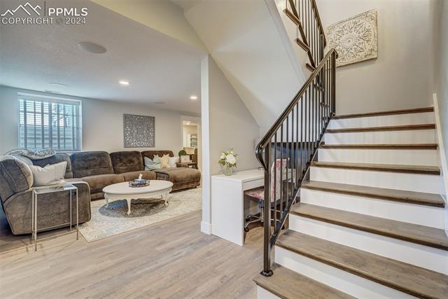 24076 Kobilan Road Calhan, CO 80808 - Photo 26 of 50 Staircase with light wood-type flooring
