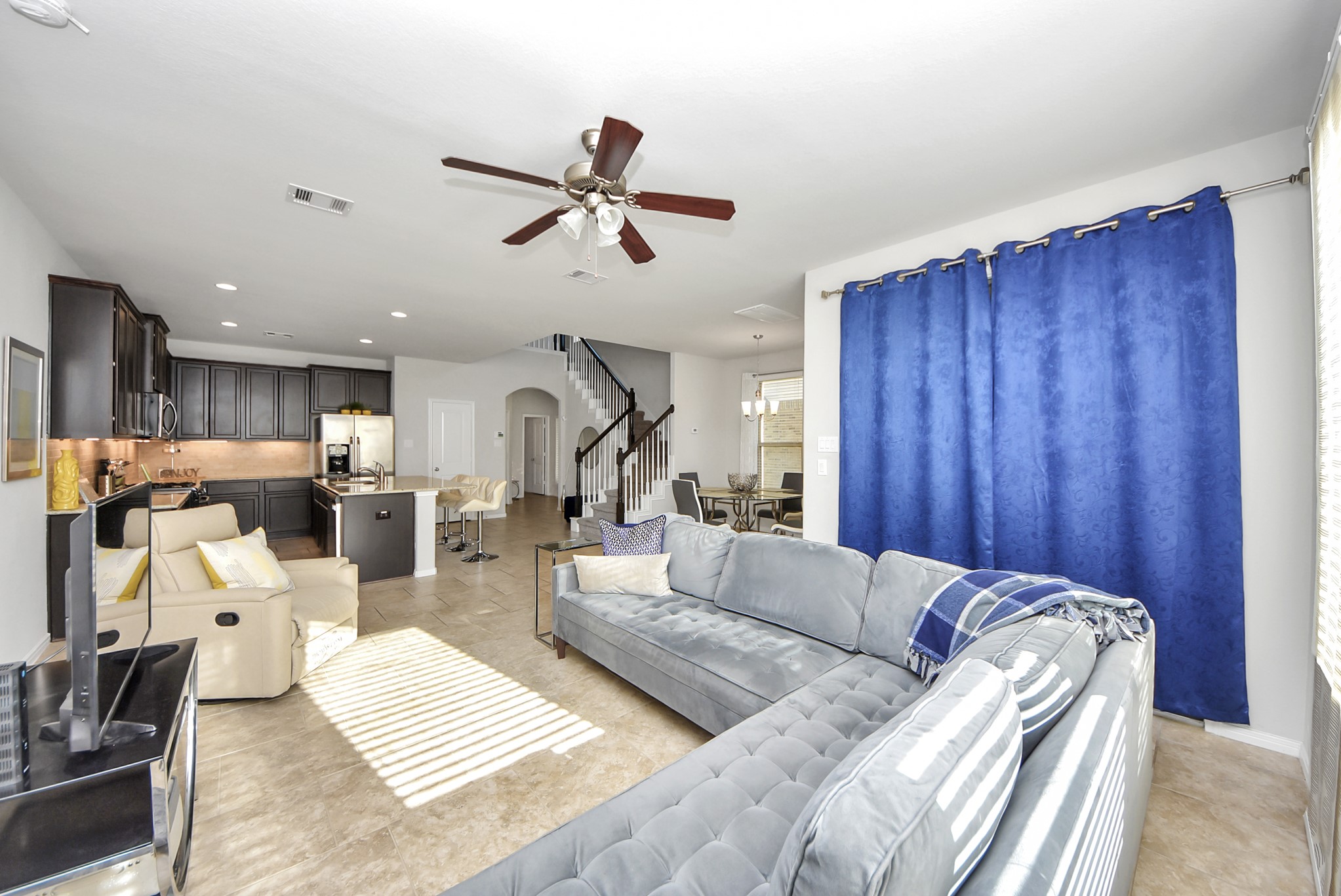 3310 Rainflower Springs Lane Rosenberg, TX 77471 - Photo 11 of 31 A close-up of the living room area featuring stylish decor, a cozy seating arrangement, and a comfortable layout.