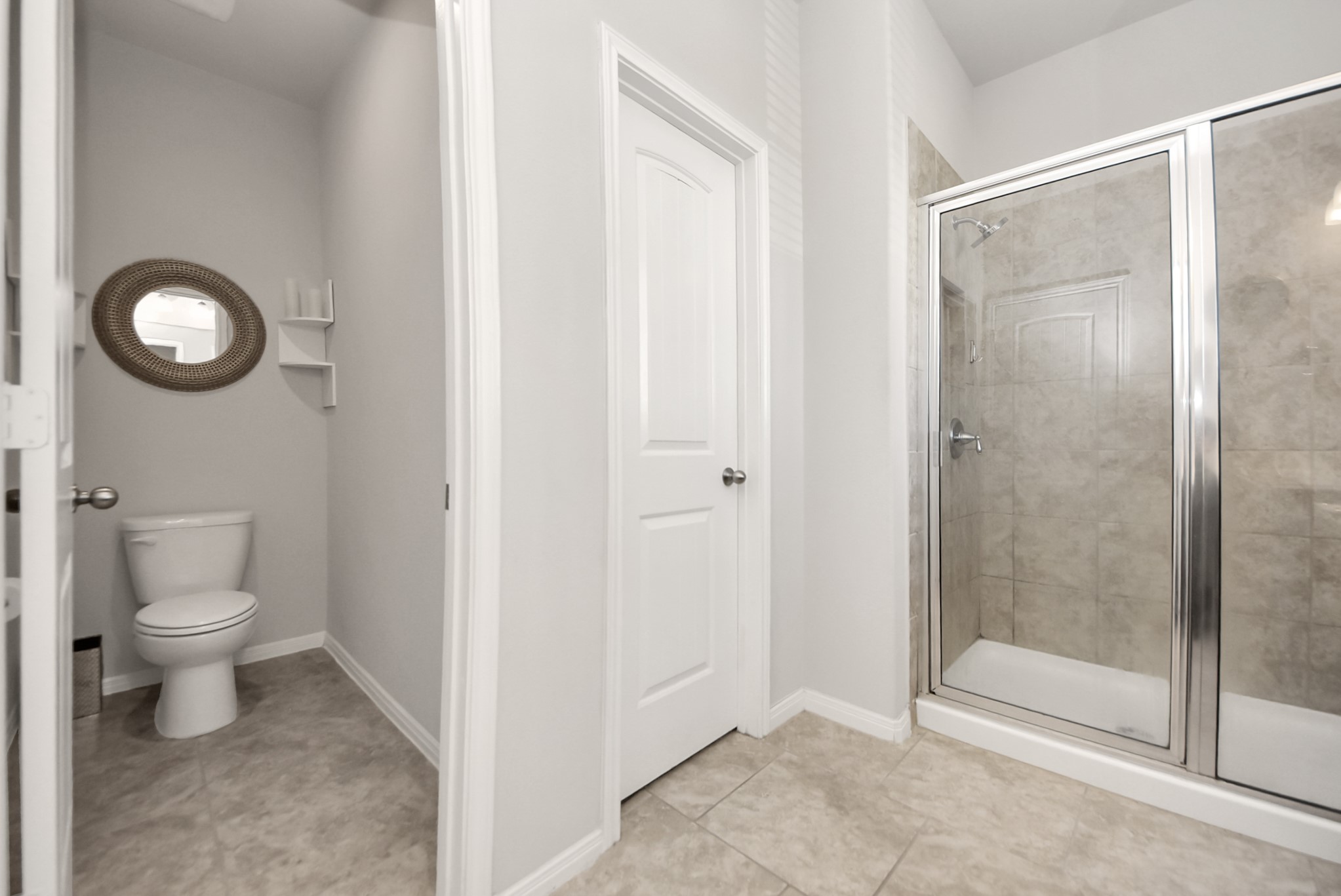 3310 Rainflower Springs Lane Rosenberg, TX 77471 - Photo 20 of 31 Featuring dual sinks, a modern vanity, and a sleek shower area, this well-designed bathroom offers both comfort and functionality.