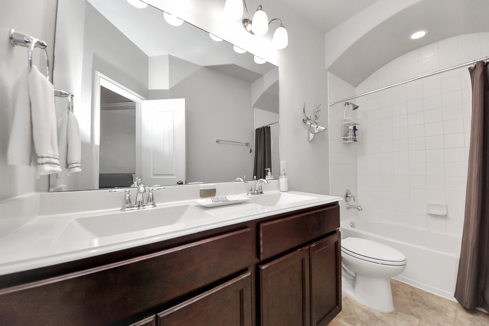 3310 Rainflower Springs Lane Rosenberg, TX 77471 - Photo 21 of 31 A cozy loft area overlooking the living space below, complete with soft carpet and large windows that let in natural light.