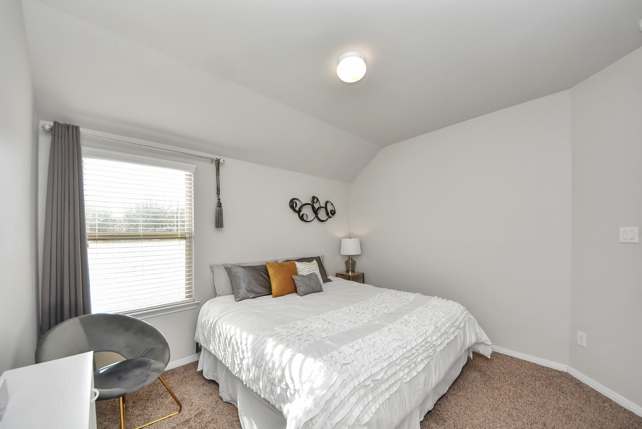 3310 Rainflower Springs Lane Rosenberg, TX 77471 - Photo 25 of 31 Featuring a clean and stylish design, this bedroom boasts neutral tones and plenty of space for your furniture and personal touches.