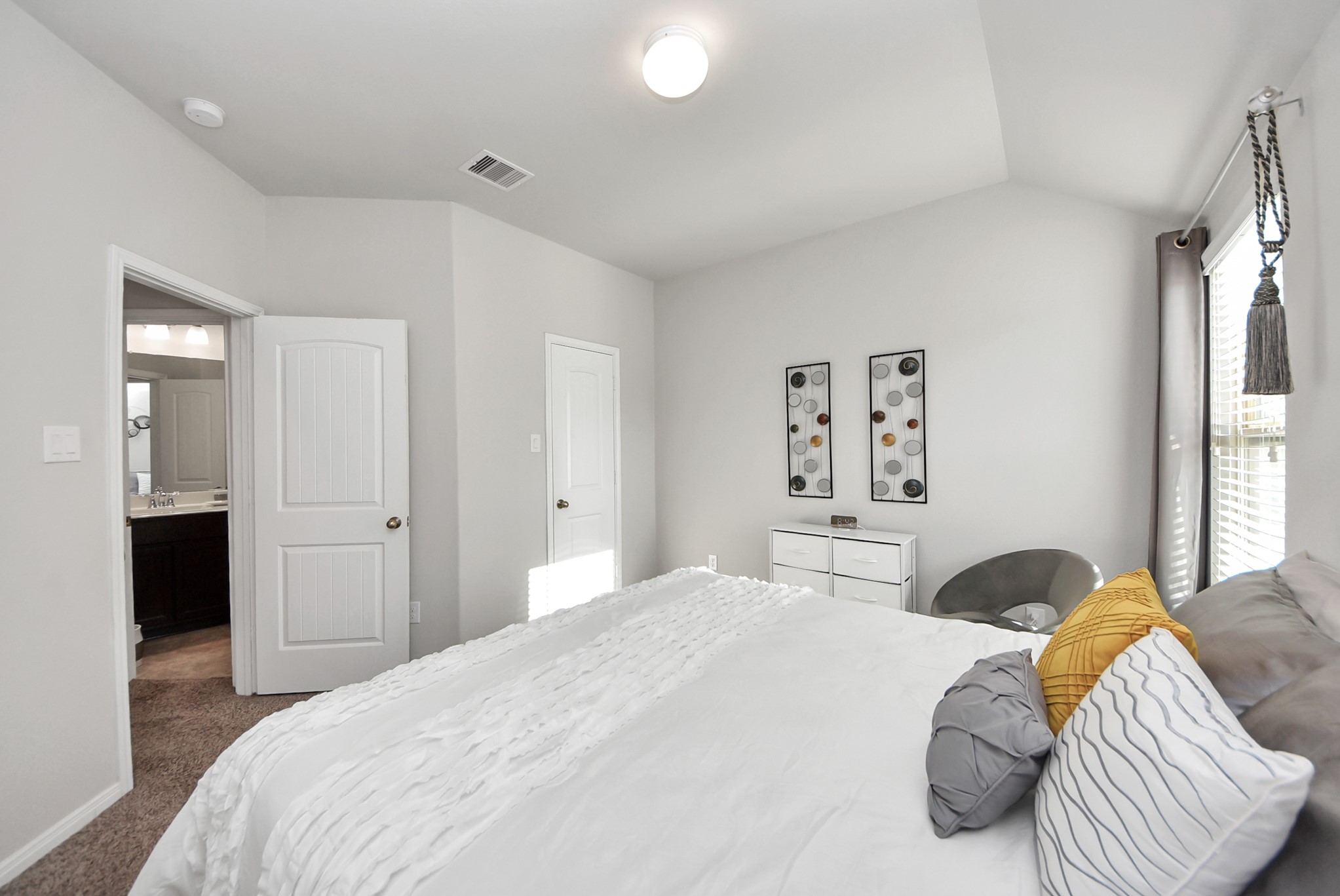 3310 Rainflower Springs Lane Rosenberg, TX 77471 - Photo 26 of 31 A beautifully arranged open living space with a view of the dining area, featuring a bright atmosphere and contemporary finishes.