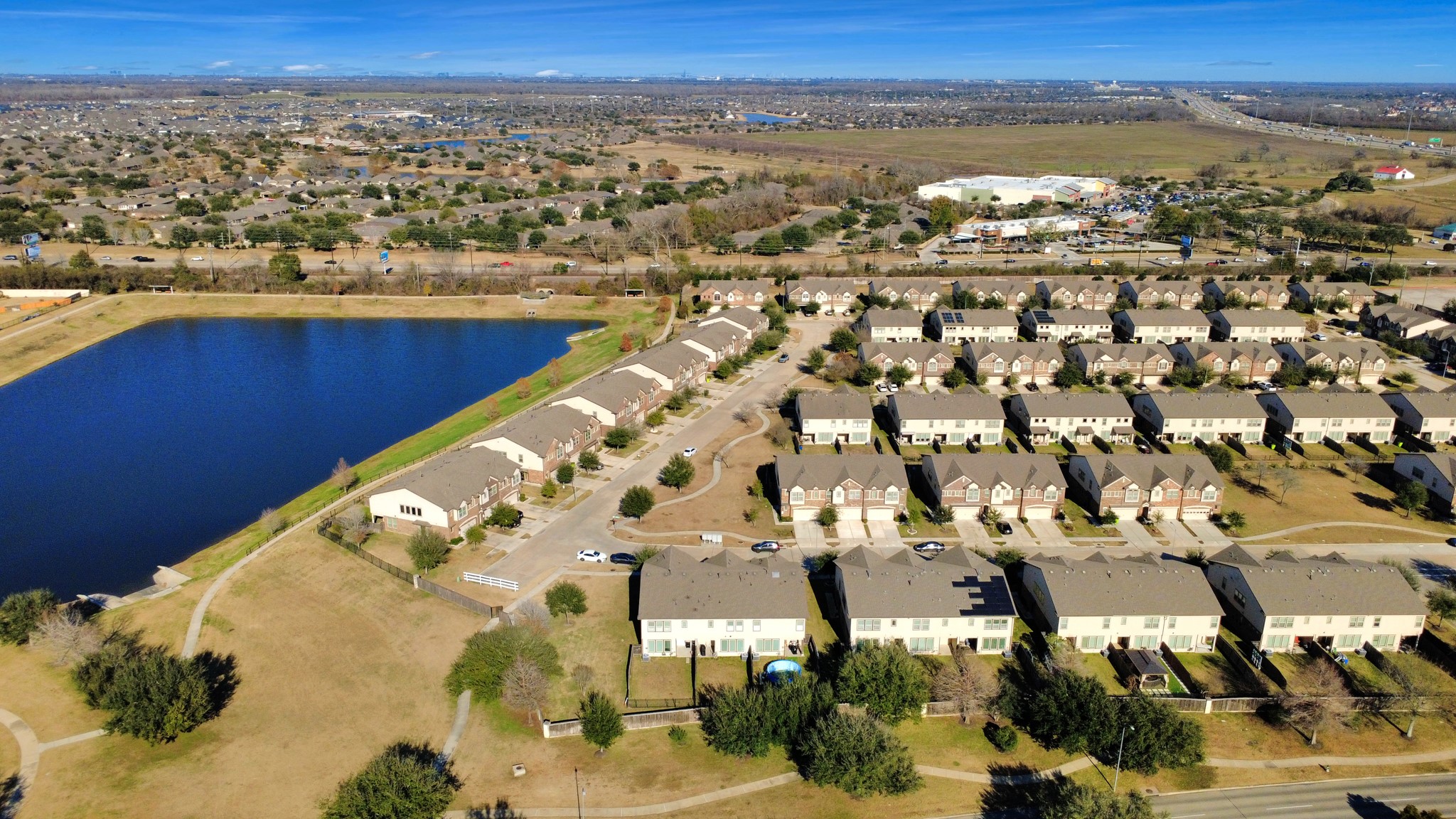3310 Rainflower Springs Lane Rosenberg, TX 77471 - Photo 29 of 31 A stunning bird's-eye view of the neighborhood with scenic landscapes, well-kept homes, and a peaceful environment.