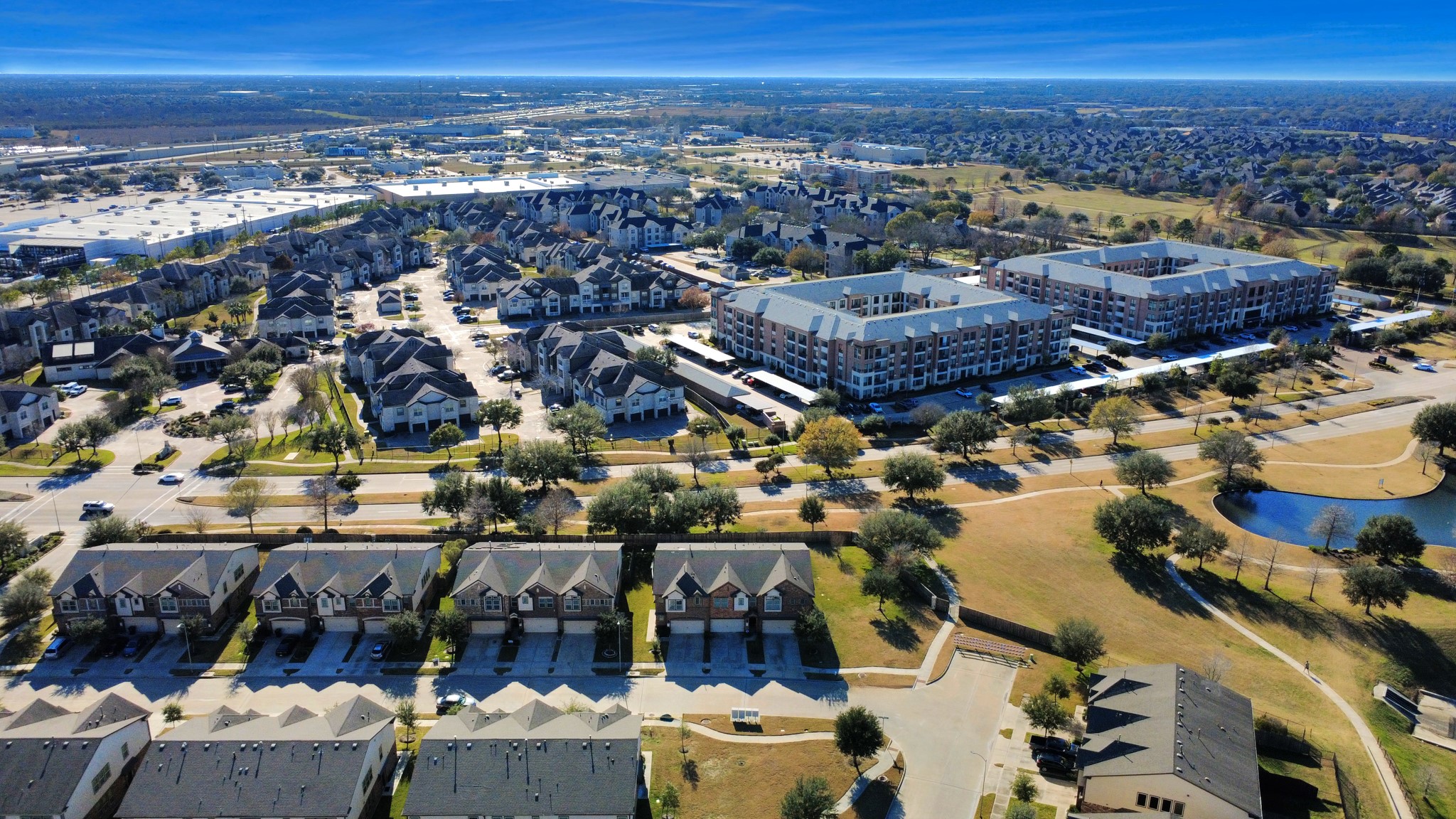 3310 Rainflower Springs Lane Rosenberg, TX 77471 - Photo 30 of 31 A spacious and airy living room with large windows, ideal for relaxation or hosting gatherings with friends and family.