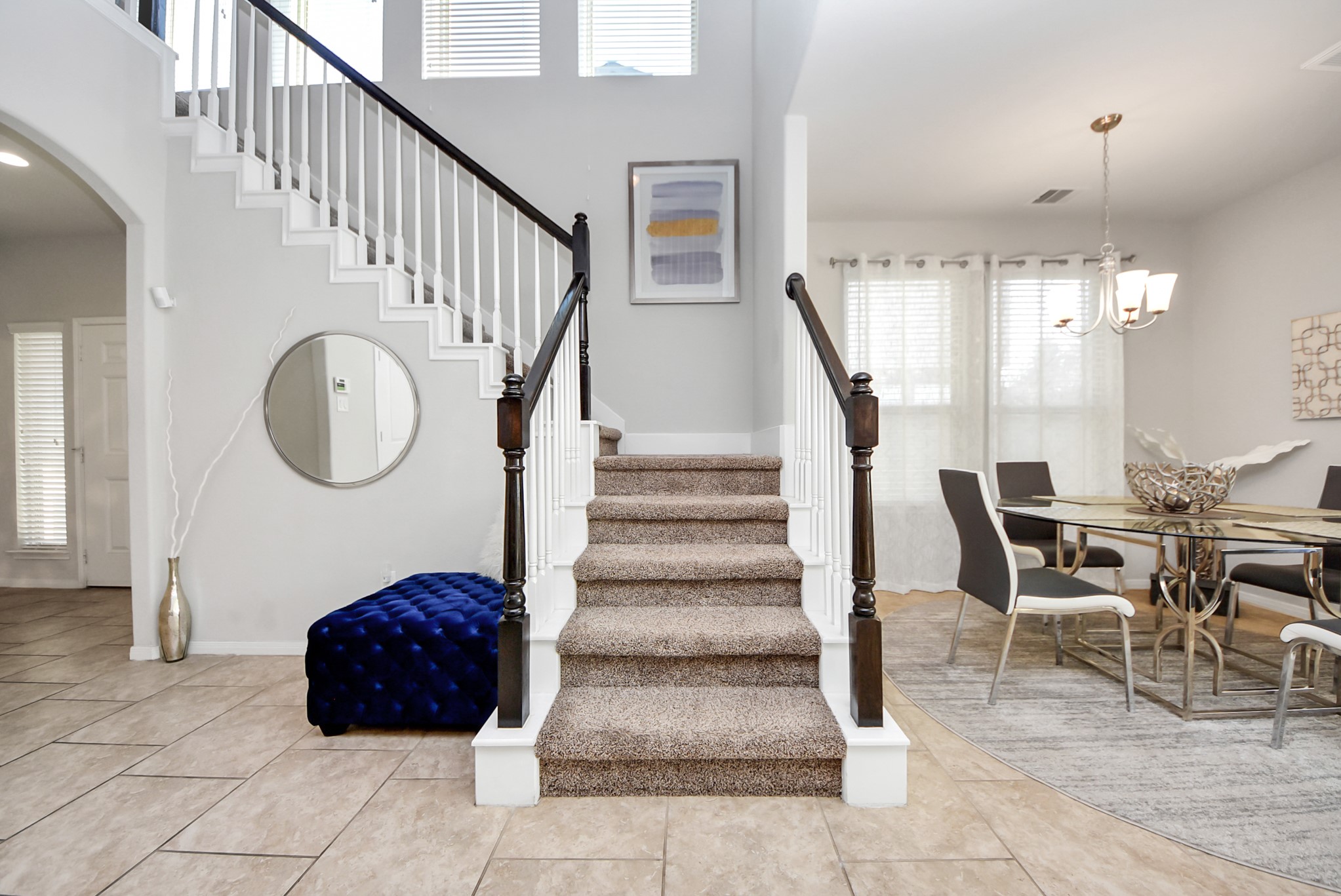3310 Rainflower Springs Lane Rosenberg, TX 77471 - Photo 6 of 31 Elegant staircase leading to the upper level, adding a touch of sophistication to the living space.
