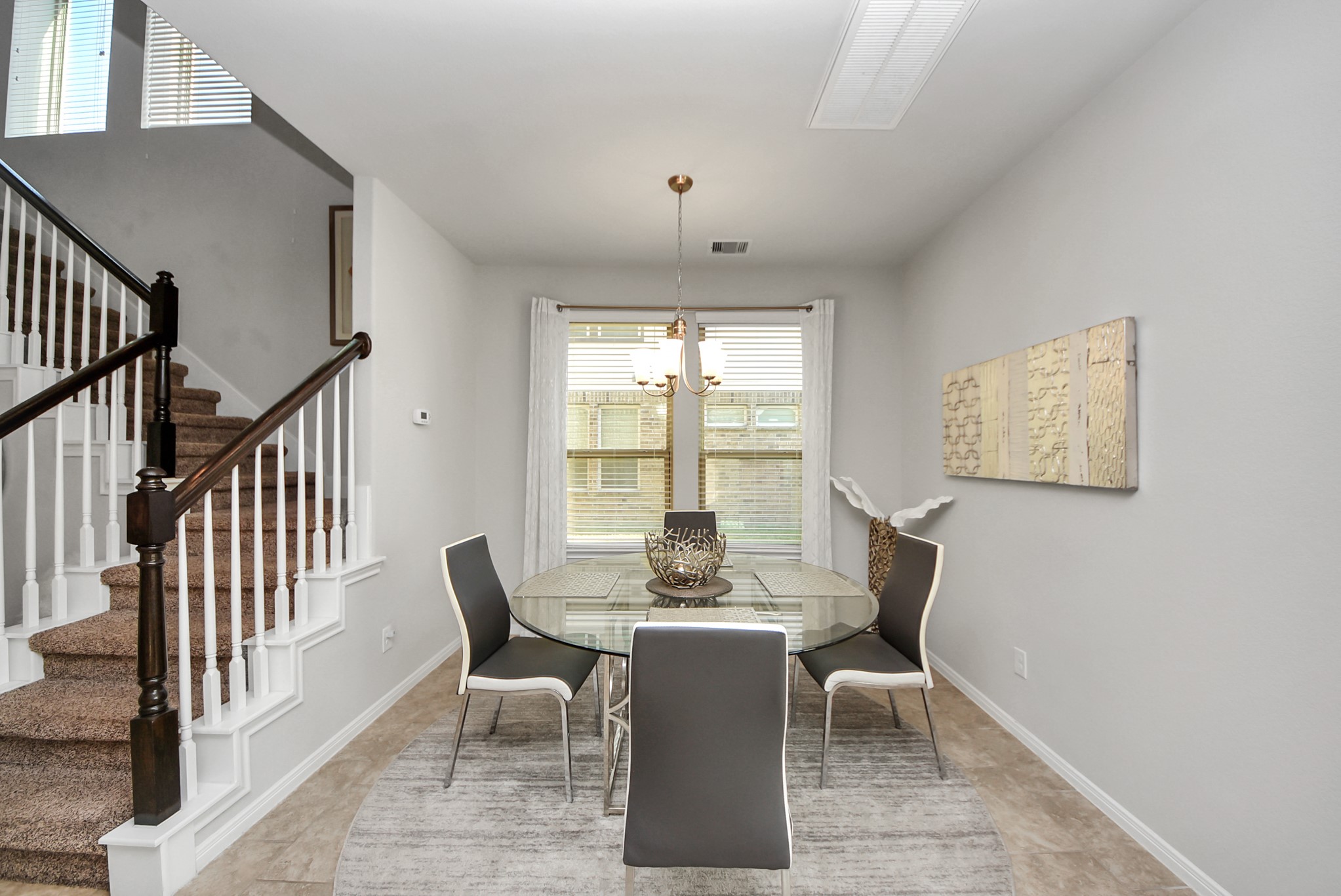 3310 Rainflower Springs Lane Rosenberg, TX 77471 - Photo 7 of 31 Charming dining area with natural light pouring in, perfect for family meals and entertaining.
Spacious and inviting living room, with plenty of light and cozy seating — a perfect place to relax.