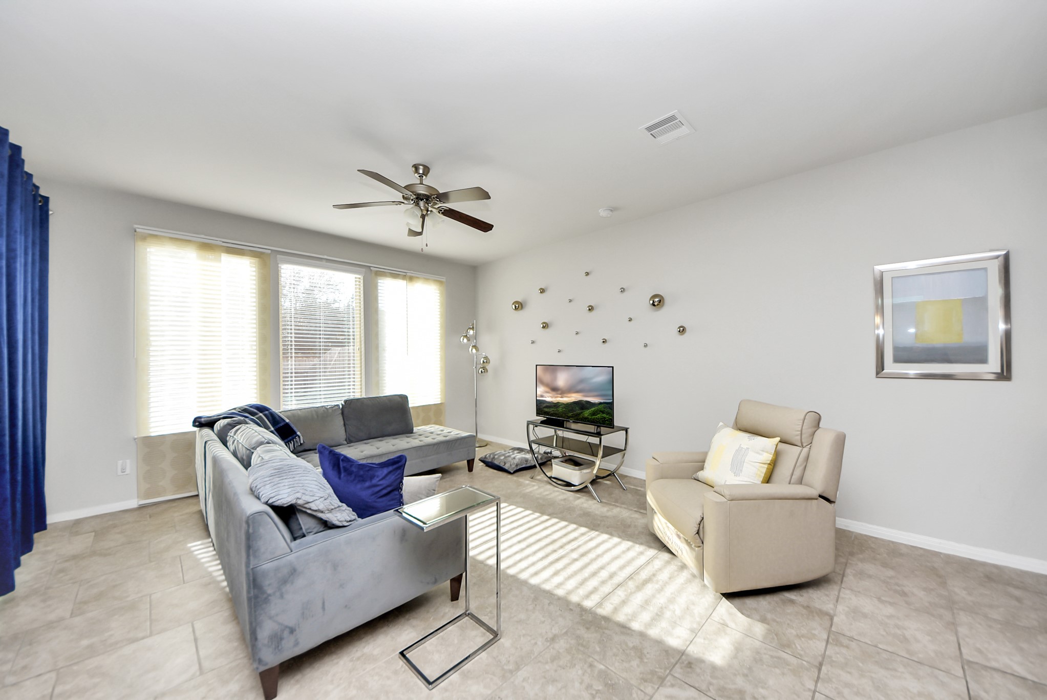 3310 Rainflower Springs Lane Rosenberg, TX 77471 - Photo 9 of 31 Another angle of the bright living room, showing a seamless connection to the dining area and kitchen.