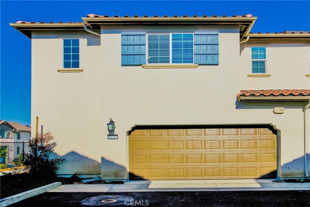 31727 Willowood Way Menifee, CA 92584 - Photo 1 of 31 a view of a blue house with large windows