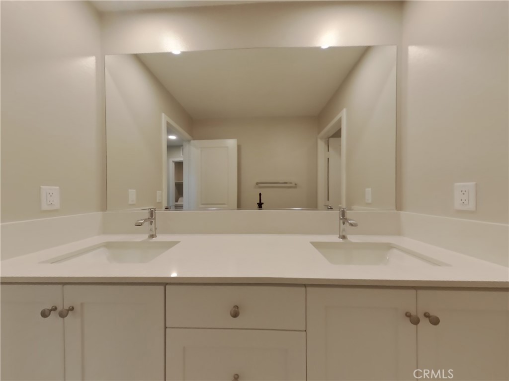 31727 Willowood Way Menifee, CA 92584 - Photo 13 of 31 a bathroom with a sink and a mirror