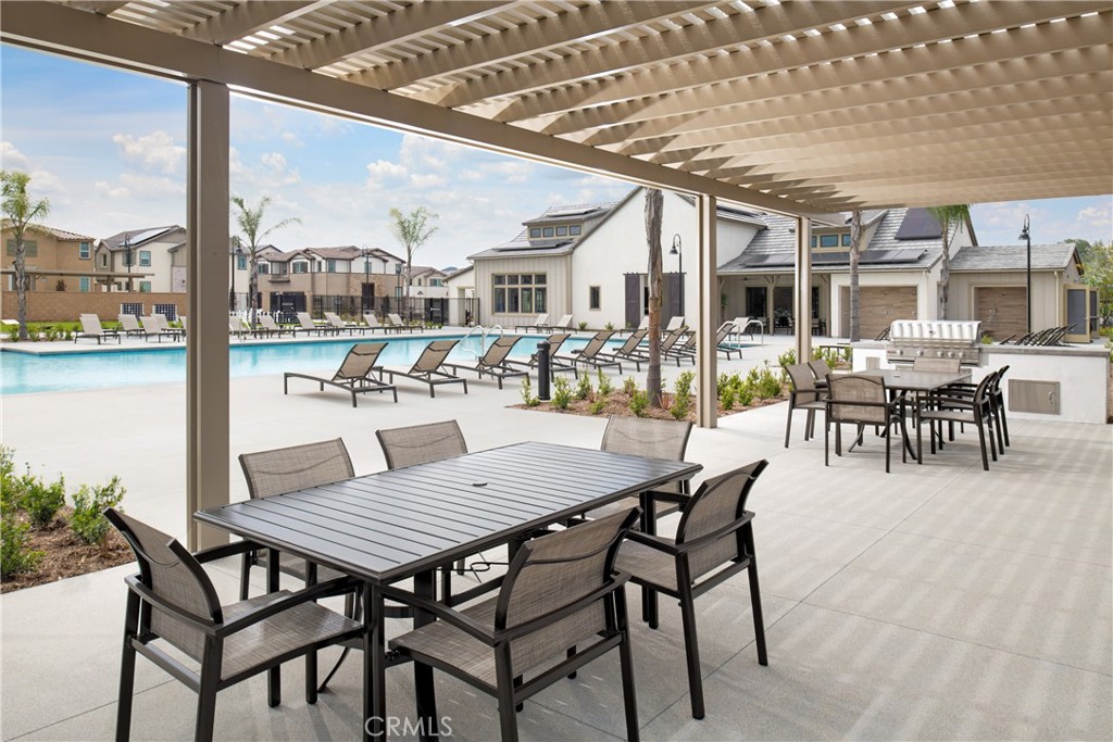 31727 Willowood Way Menifee, CA 92584 - Photo 20 of 31 a view of a patio with a table and chairs