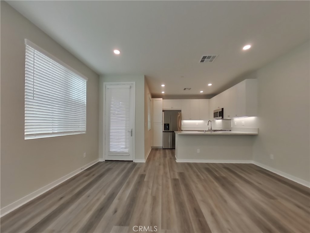 31727 Willowood Way Menifee, CA 92584 - Photo 2 of 31 a view of a kitchen with a sink and a large window
