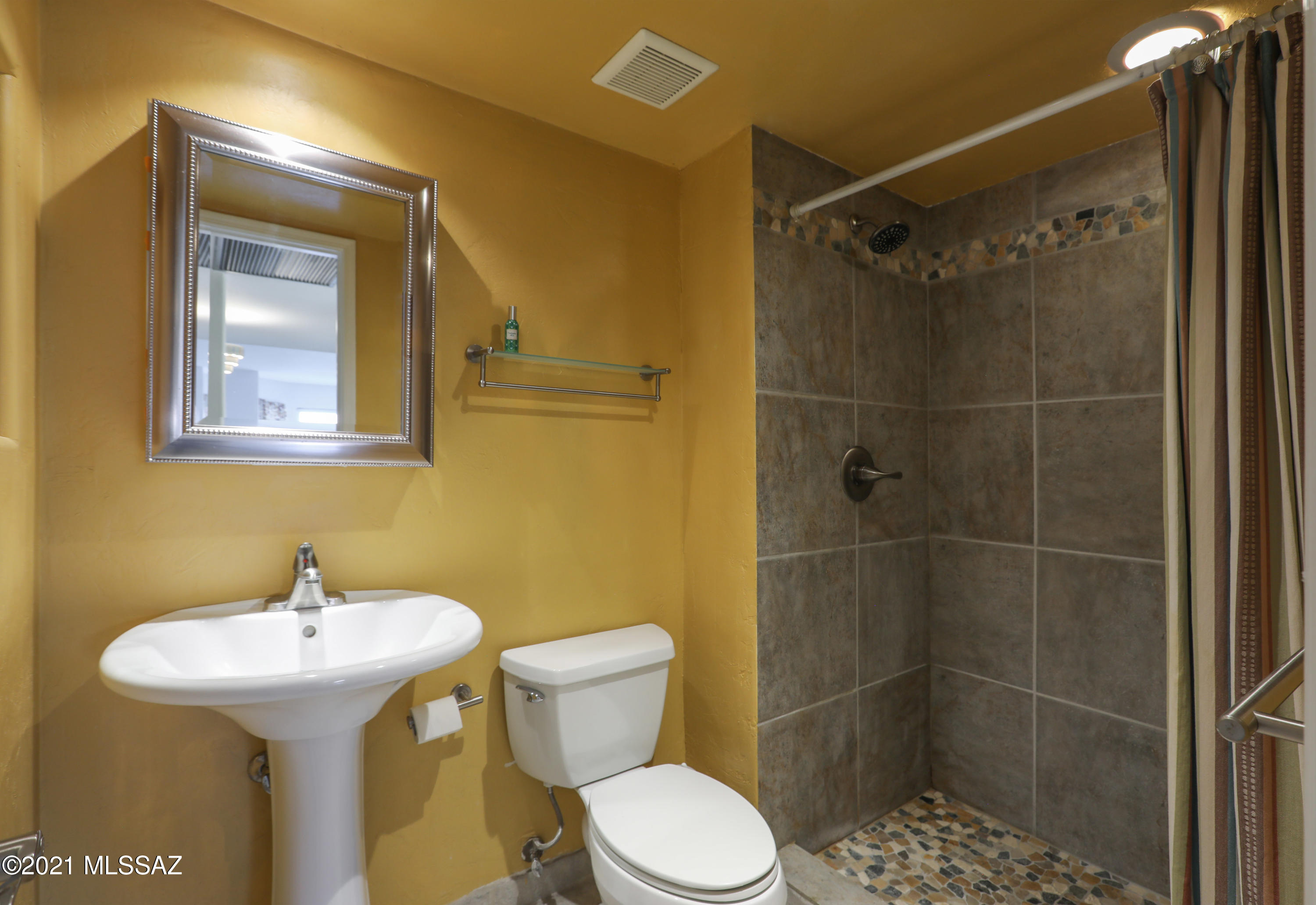 12560 North Wayfarer Way Oro Valley, AZ 85755 - Photo 41 of 43 a bathroom with a sink toilet and shower