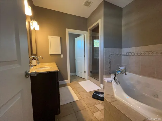 a bathroom with a bathtub and a sink
