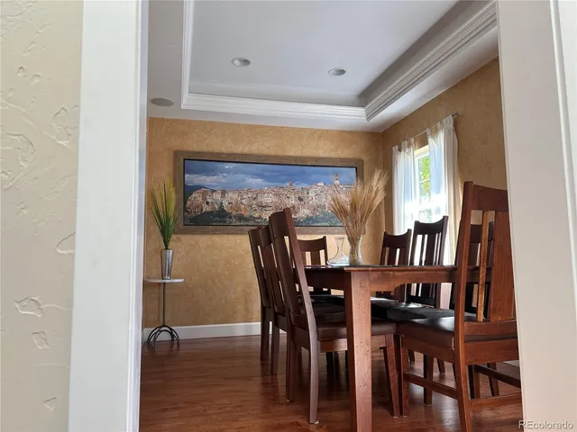 a view of a dining room with furniture and window