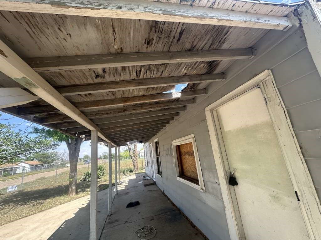 3406 East 15th Street Lubbock, TX 79403 - Photo 3 of 9 a view of a hallway with wooden floor