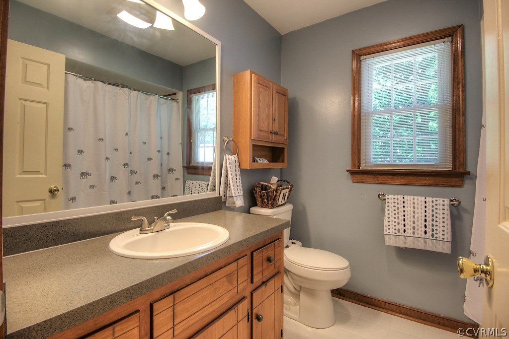 3108 Nahant Road Midlothian, VA 23112 - Photo 23 of 29 a bathroom with a sink toilet a mirror and shower