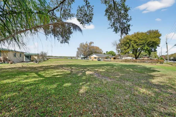 a view of a golf course with a lake