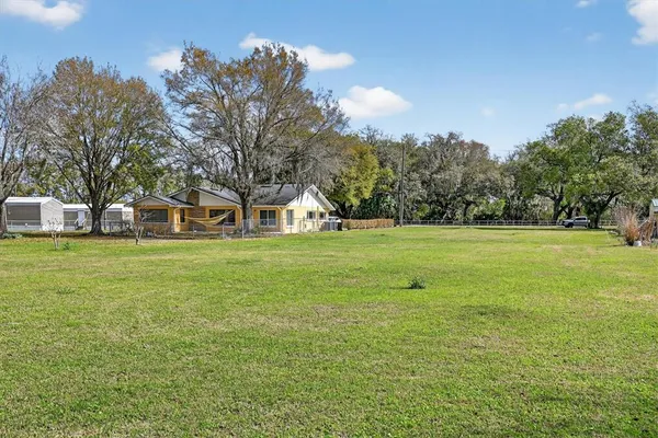 a view of a house with a big yard