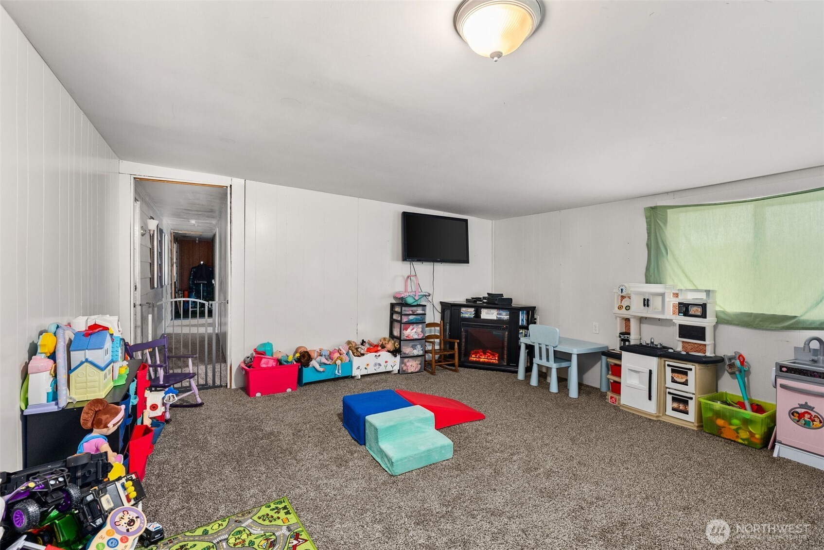 738 Gish Road Onalaska, WA 98570 - Photo 13 of 40 a room with toys and a flat screen tv