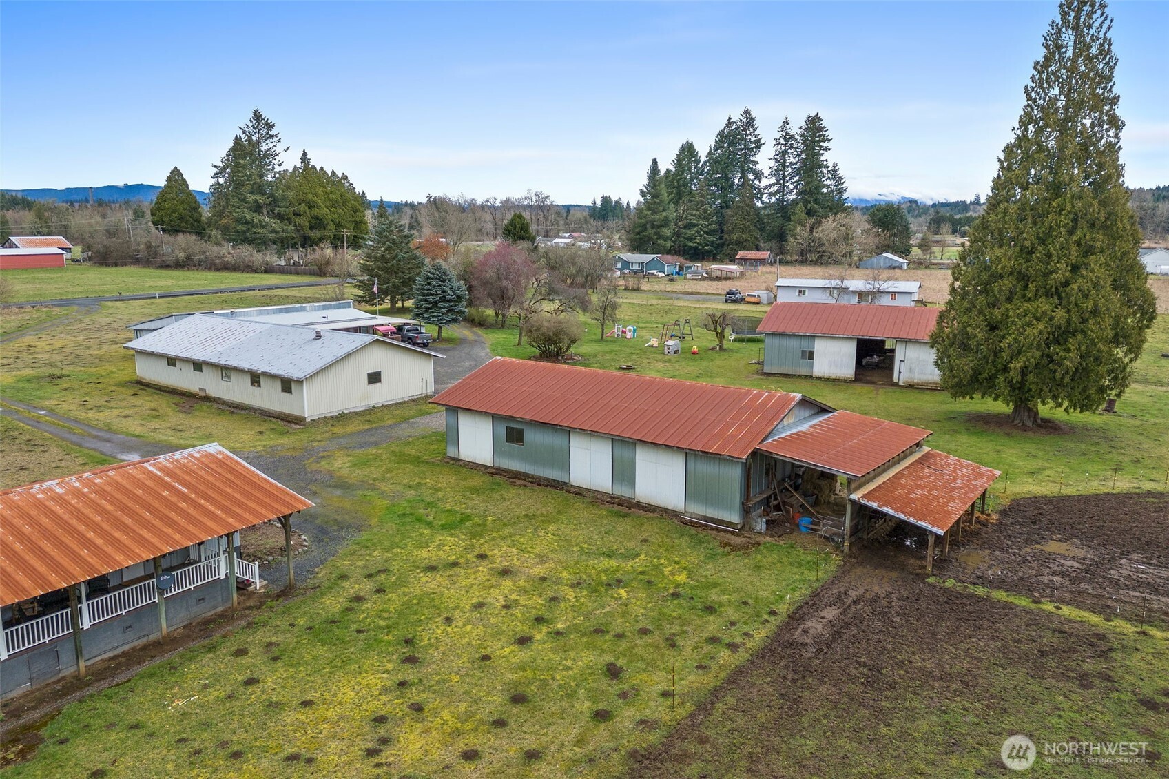 738 Gish Road Onalaska, WA 98570 - Photo 2 of 40 an aerial view of a house with swimming pool garden view and trees