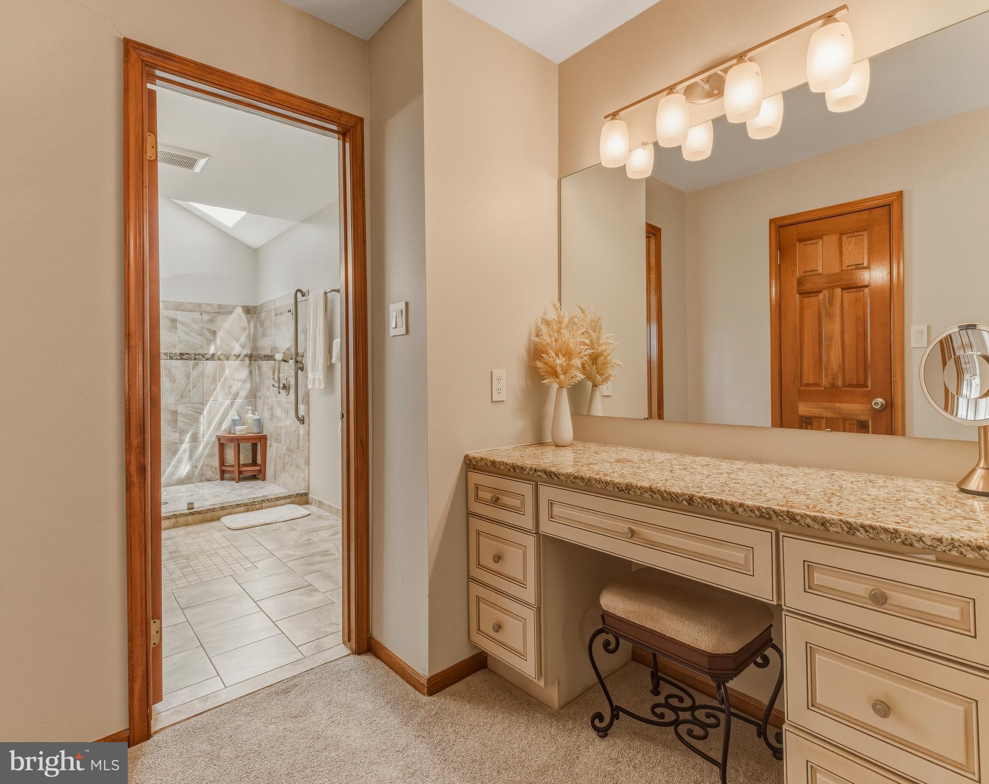 8 Rothschild Court West Deptford, NJ 08096 - Photo 19 of 29 a bathroom with a granite countertop sink a vanity and a large mirror