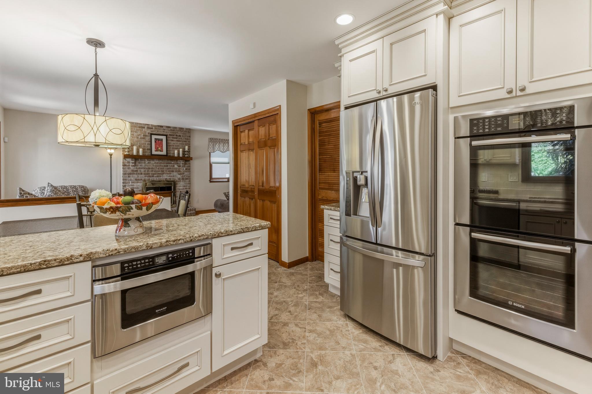 8 Rothschild Court West Deptford, NJ 08096 - Photo 5 of 29 a kitchen with stainless steel appliances granite countertop a refrigerator a stove and a sink