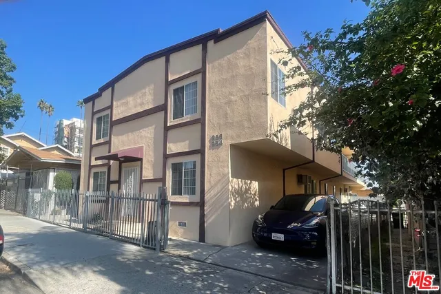 a front view of a house with parking