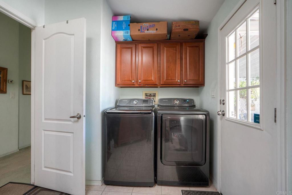 18218 Paradise Mountain Road Valley Center, CA 92082 - Photo 18 of 36 a view of a utility room with washer and dryer