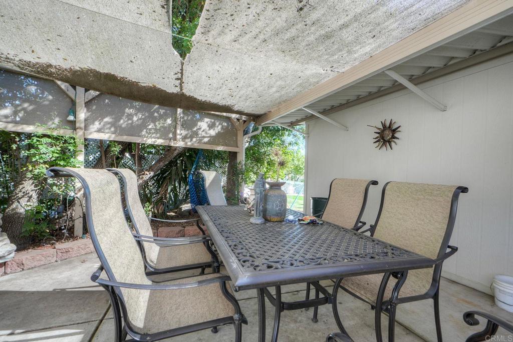 18218 Paradise Mountain Road Valley Center, CA 92082 - Photo 31 of 36 a table and chairs in patio of a building