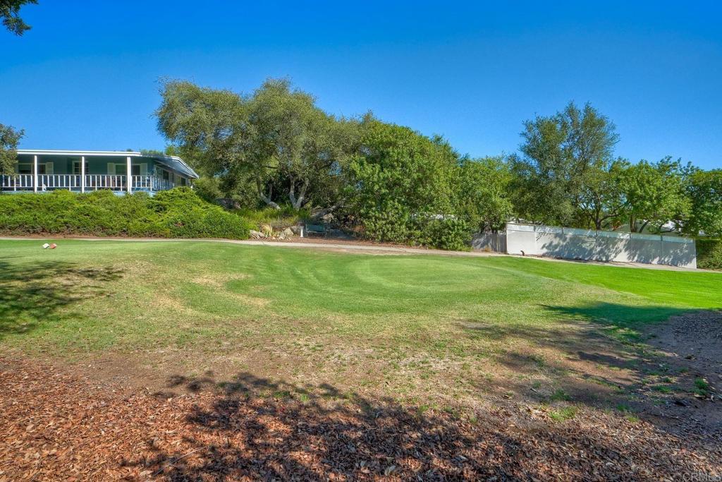 18218 Paradise Mountain Road Valley Center, CA 92082 - Photo 33 of 36 a view of a house with a yard